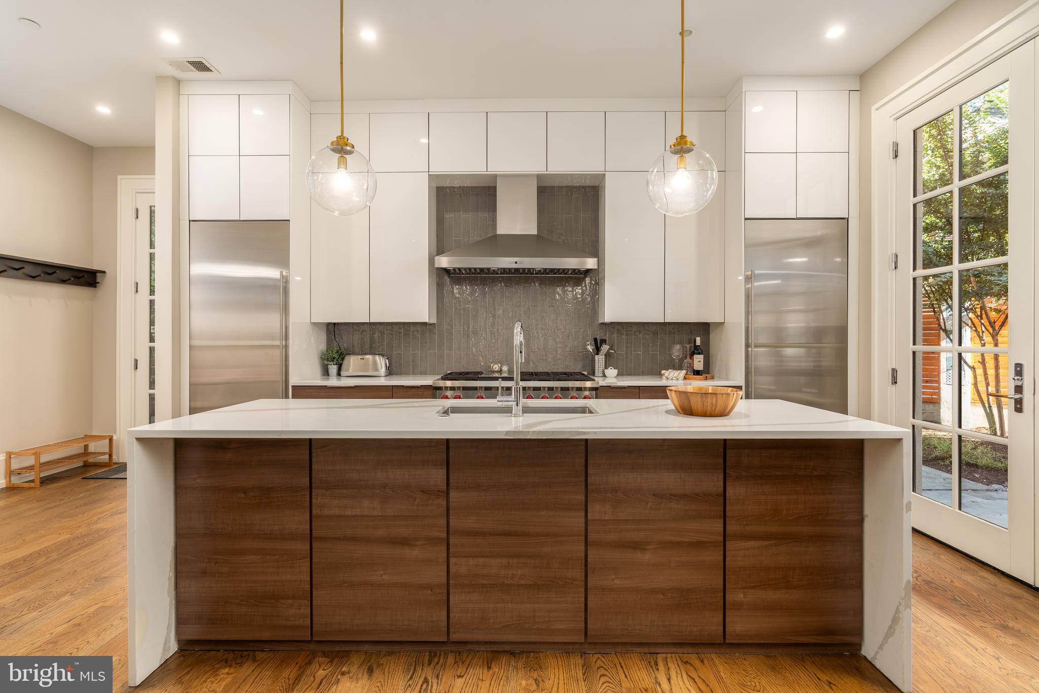 3128 Appleton Street Northwest Washington, DC 20008 - Photo 18 of 80 a kitchen with a sink stainless steel appliances and cabinets
