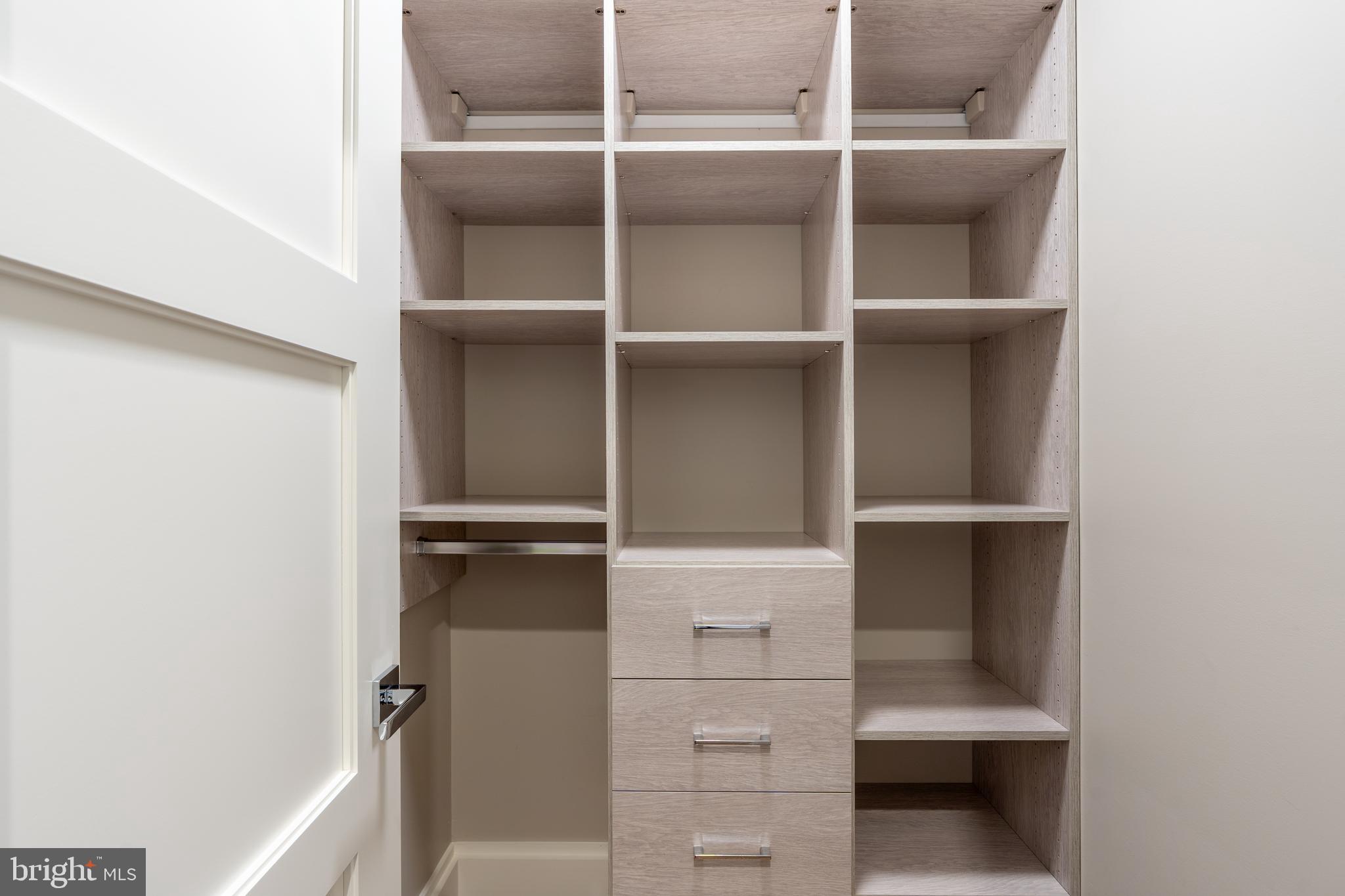 3128 Appleton Street Northwest Washington, DC 20008 - Photo 37 of 80 a view of walk in closet with empty racks