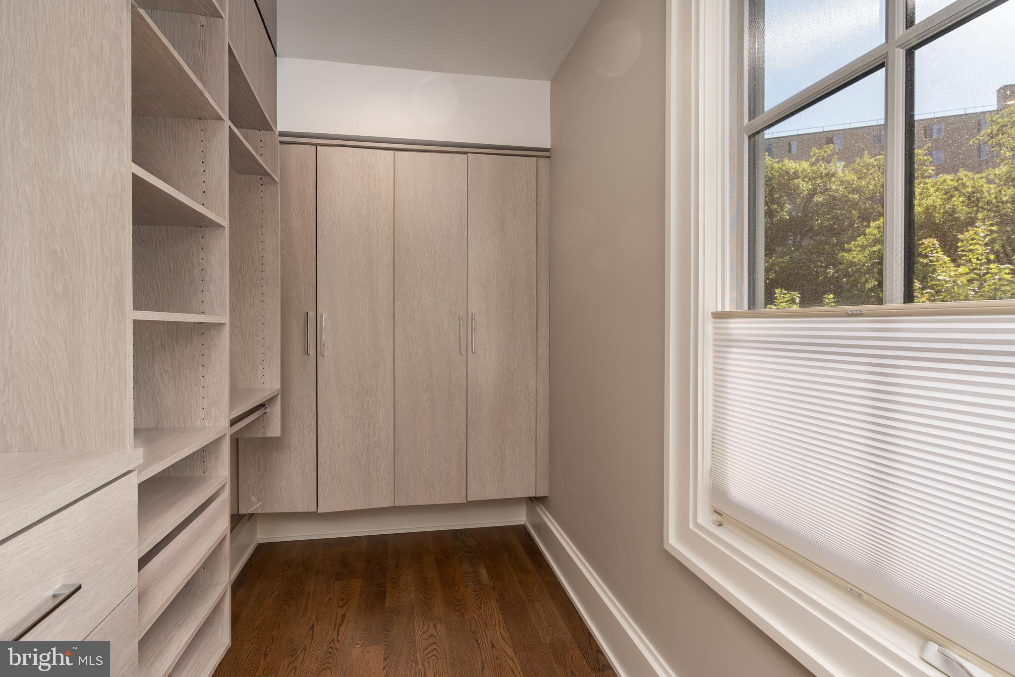 3128 Appleton Street Northwest Washington, DC 20008 - Photo 38 of 80 a view of a walk in closet with wooden floor