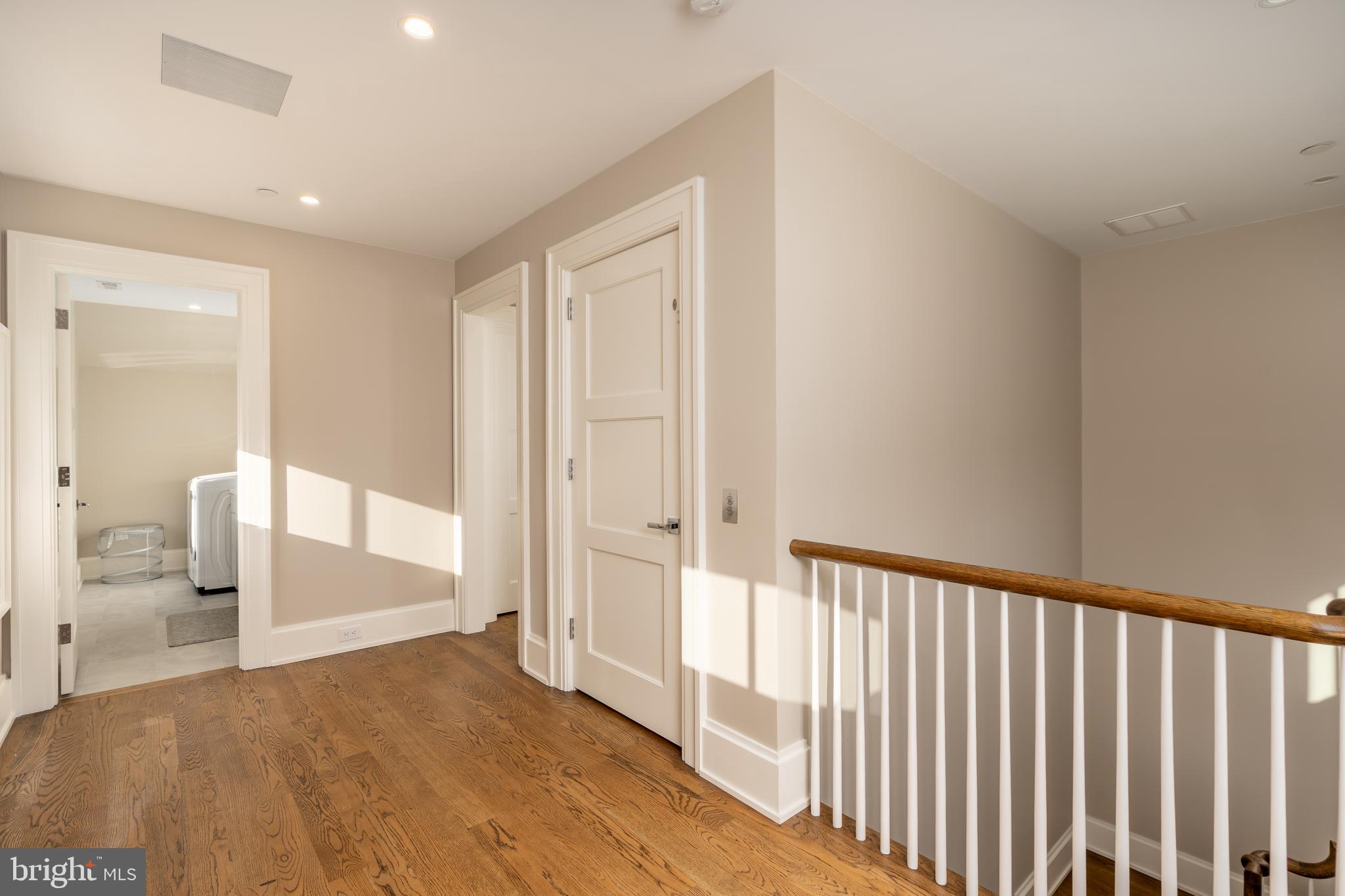 3128 Appleton Street Northwest Washington, DC 20008 - Photo 44 of 80 a view of a hallway view with wooden floor and staircase