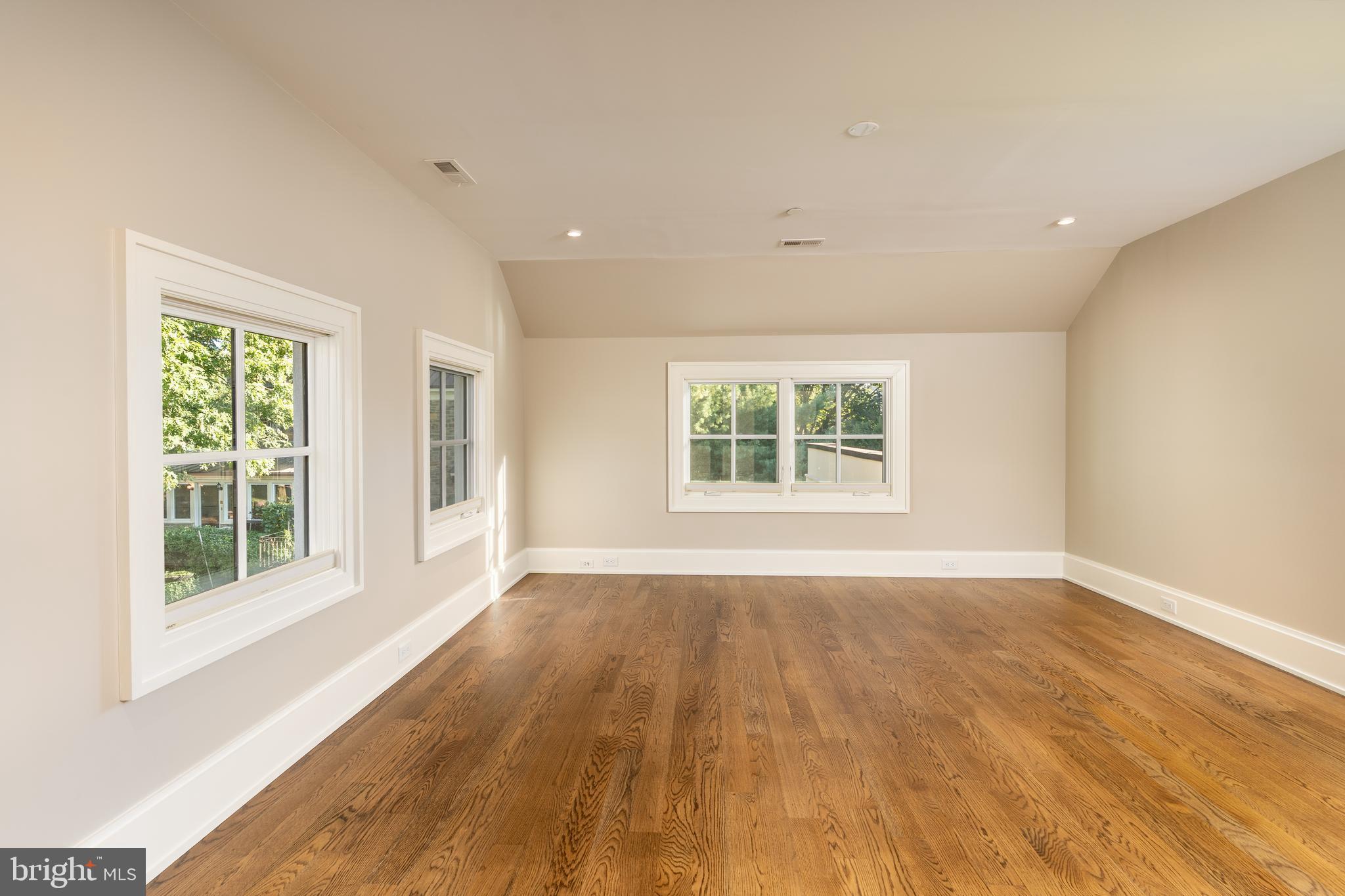 3128 Appleton Street Northwest Washington, DC 20008 - Photo 50 of 80 an empty room with wooden floor and windows