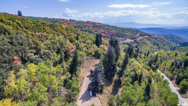 1644 West Tollgate Cyn Road, Unit 79AM Coalville, UT 84017 - Photo 25 of 31 Mountainous terrain with natural tree coverage and a winding paved road