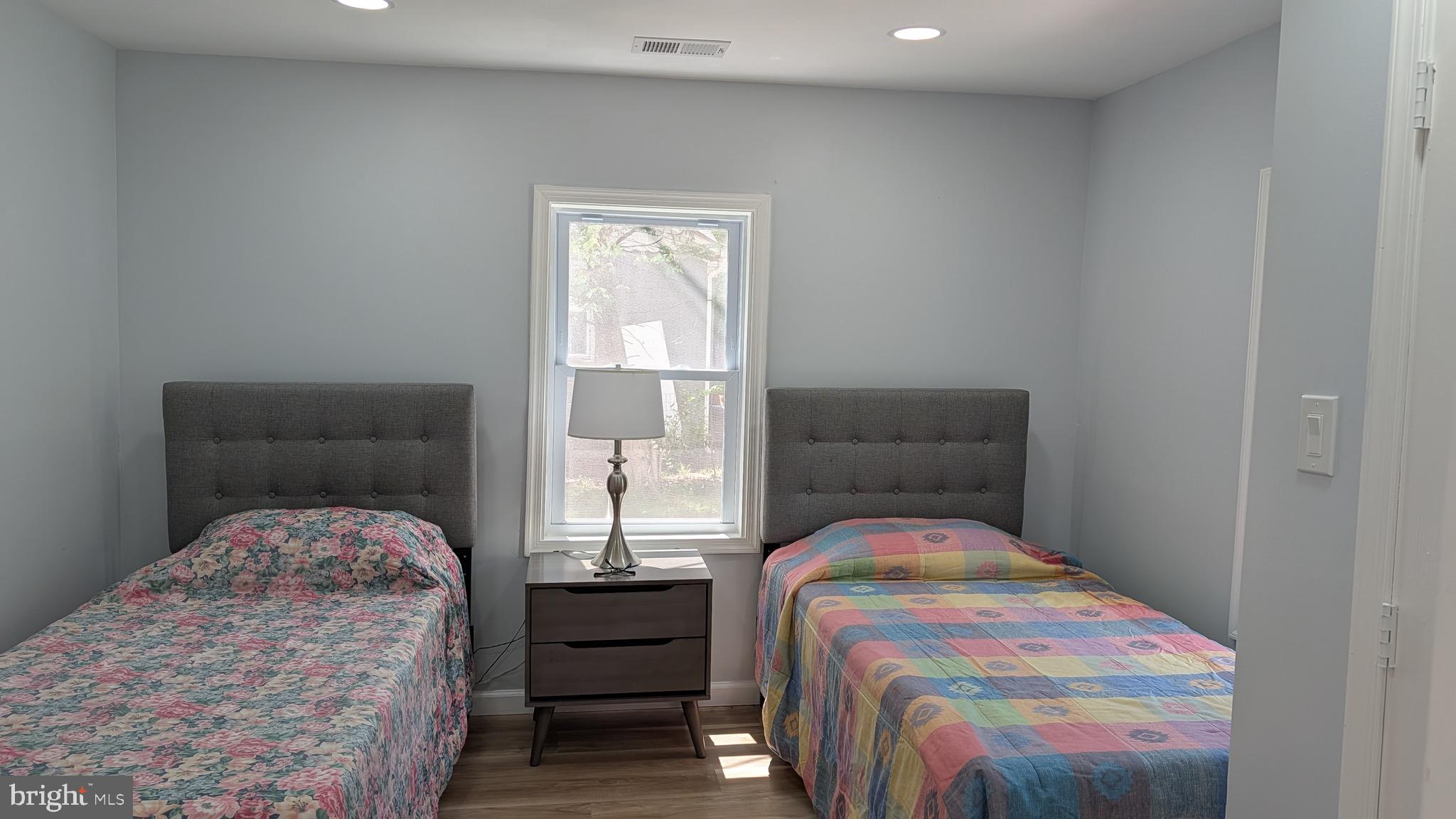 16110 Bealle Hill Road Waldorf, MD 20601 - Photo 15 of 18 a bedroom with a bed and window