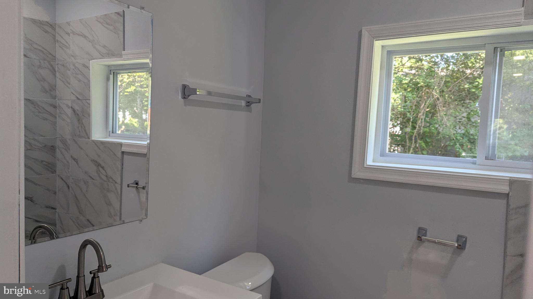 16110 Bealle Hill Road Waldorf, MD 20601 - Photo 17 of 18 a bathroom with a toilet sink and window