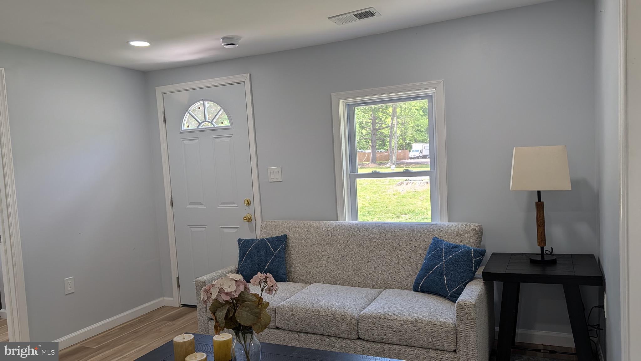 16110 Bealle Hill Road Waldorf, MD 20601 - Photo 3 of 18 a living room with furniture and a window