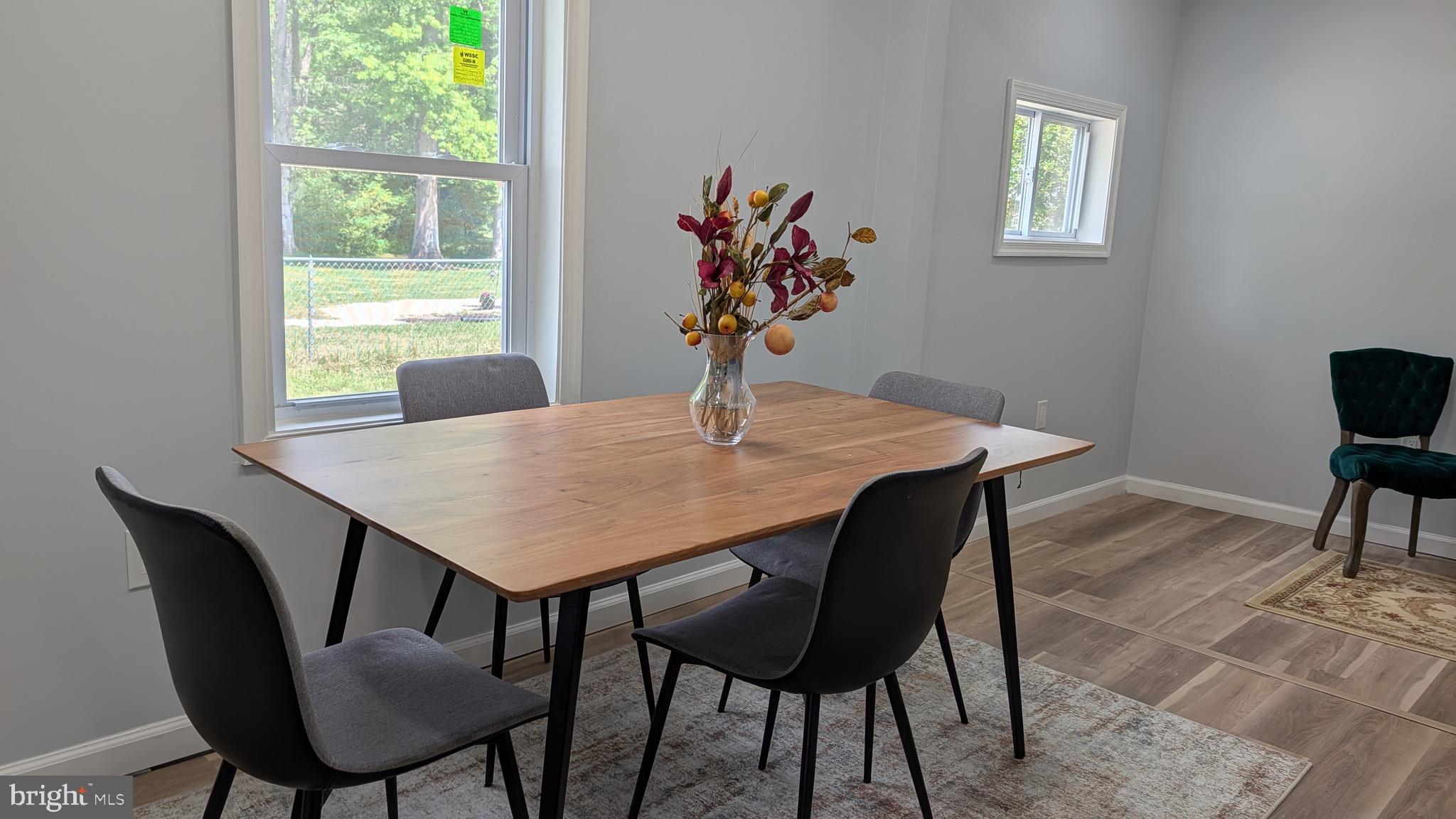 16110 Bealle Hill Road Waldorf, MD 20601 - Photo 6 of 18 a view of a dining room with furniture window and wooden floor