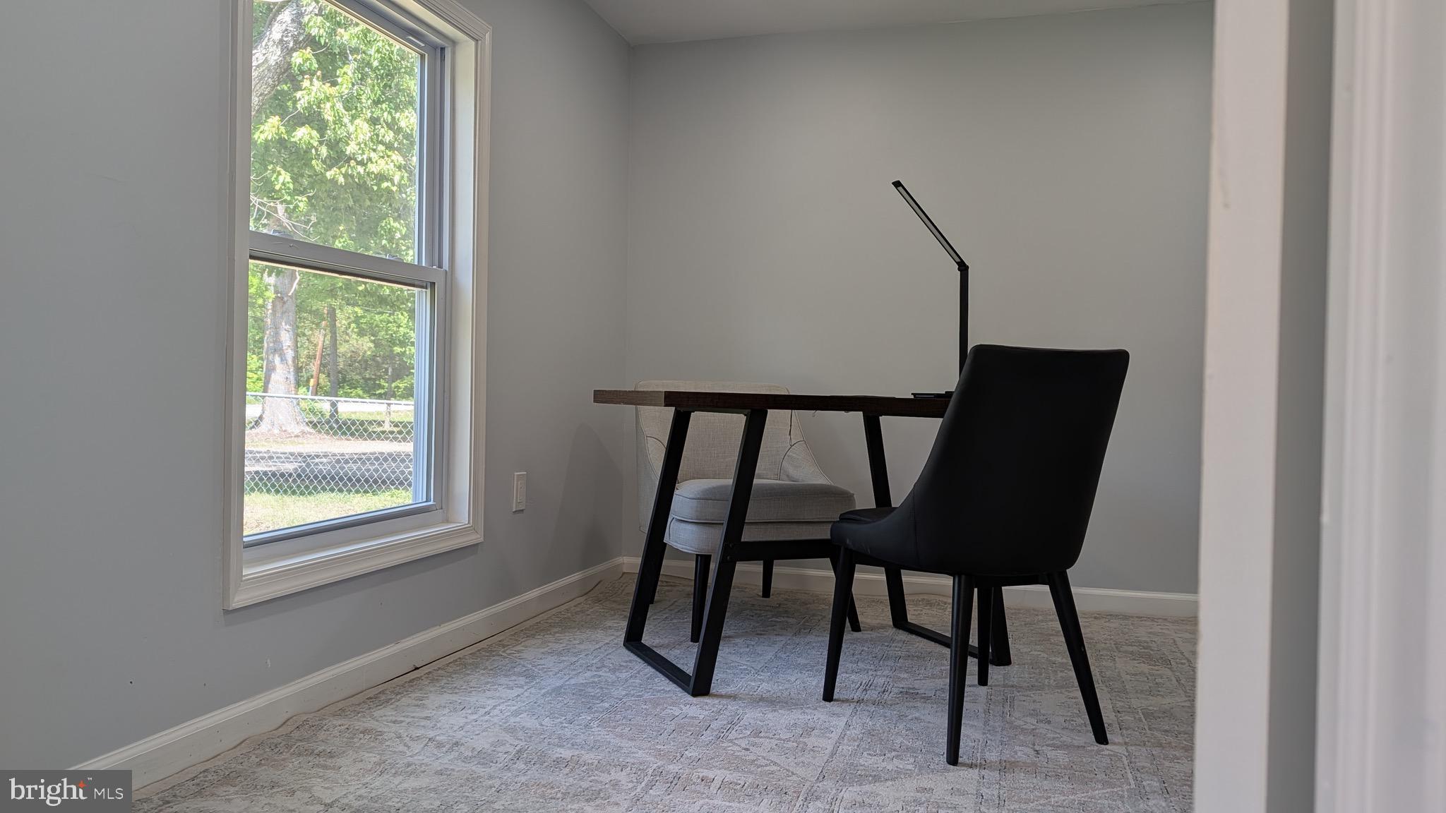 16110 Bealle Hill Road Waldorf, MD 20601 - Photo 8 of 18 a view of a workspace room with windows and furniture