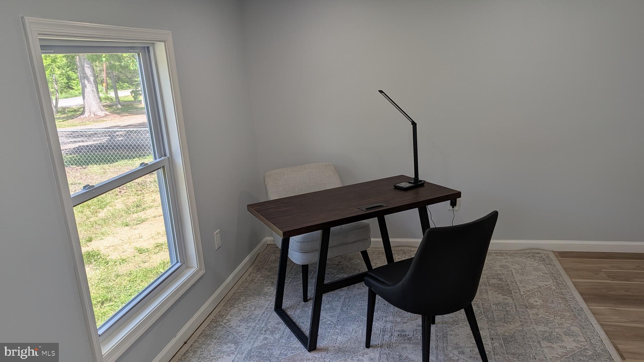 16110 Bealle Hill Road Waldorf, MD 20601 - Photo 9 of 18 a view of a workspace with furniture and a window