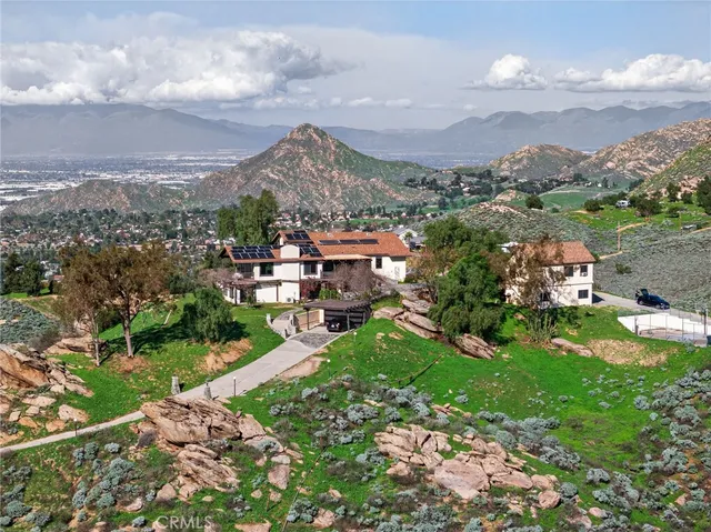 a view of a city with mountains in the background