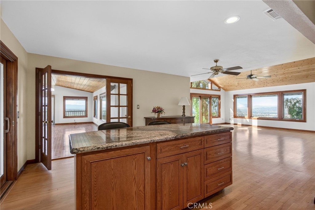 20682 Hill Top Drive Riverside, CA 92507 - Photo 13 of 70 a dining hall with stainless steel appliances granite countertop wooden cabinets a granite counter tops and a window