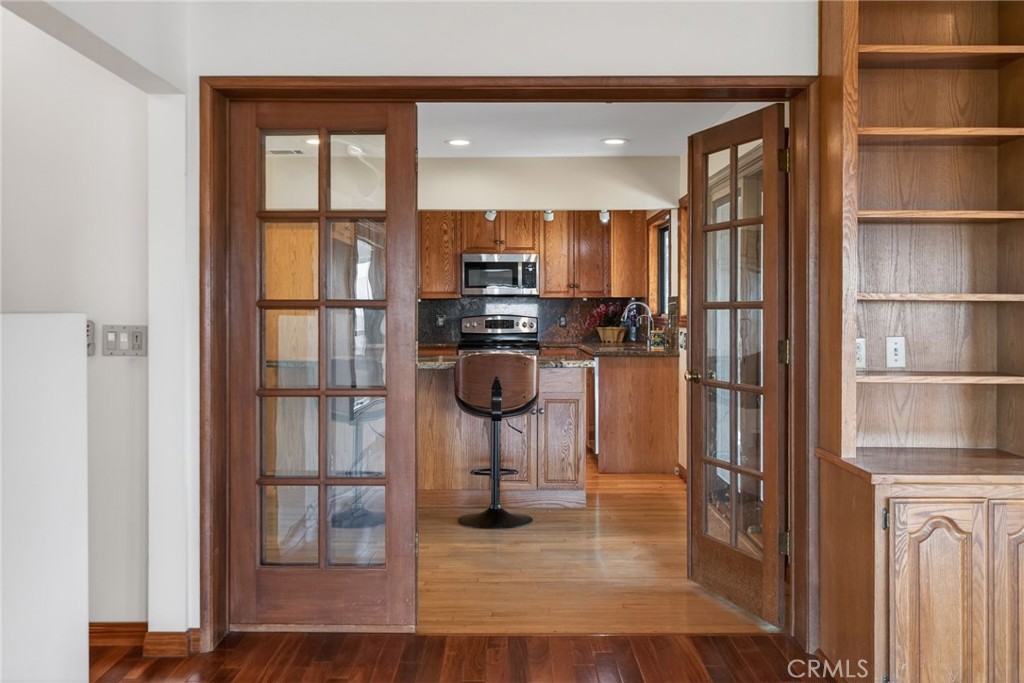 20682 Hill Top Drive Riverside, CA 92507 - Photo 28 of 70 a kitchen with stainless steel appliances granite countertop a refrigerator and a stove top oven