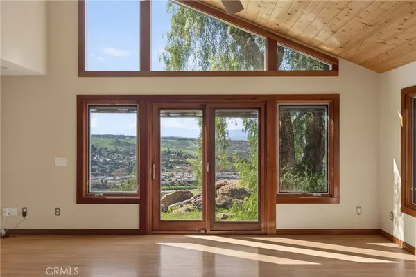 a view of a room that has a large window