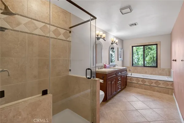a kitchen with a stove a sink and a refrigerator