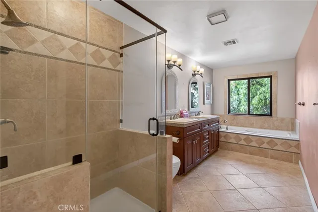 a view of a big room with wooden floor and windows