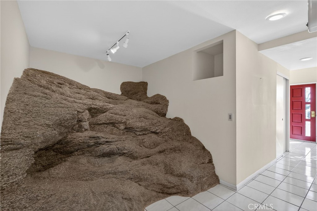 20682 Hill Top Drive Riverside, CA 92507 - Photo 39 of 70 a bedroom with a bed and a window