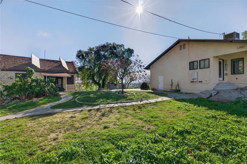 20682 Hill Top Drive Riverside, CA 92507 - Photo 48 of 70 a view of a house with a yard