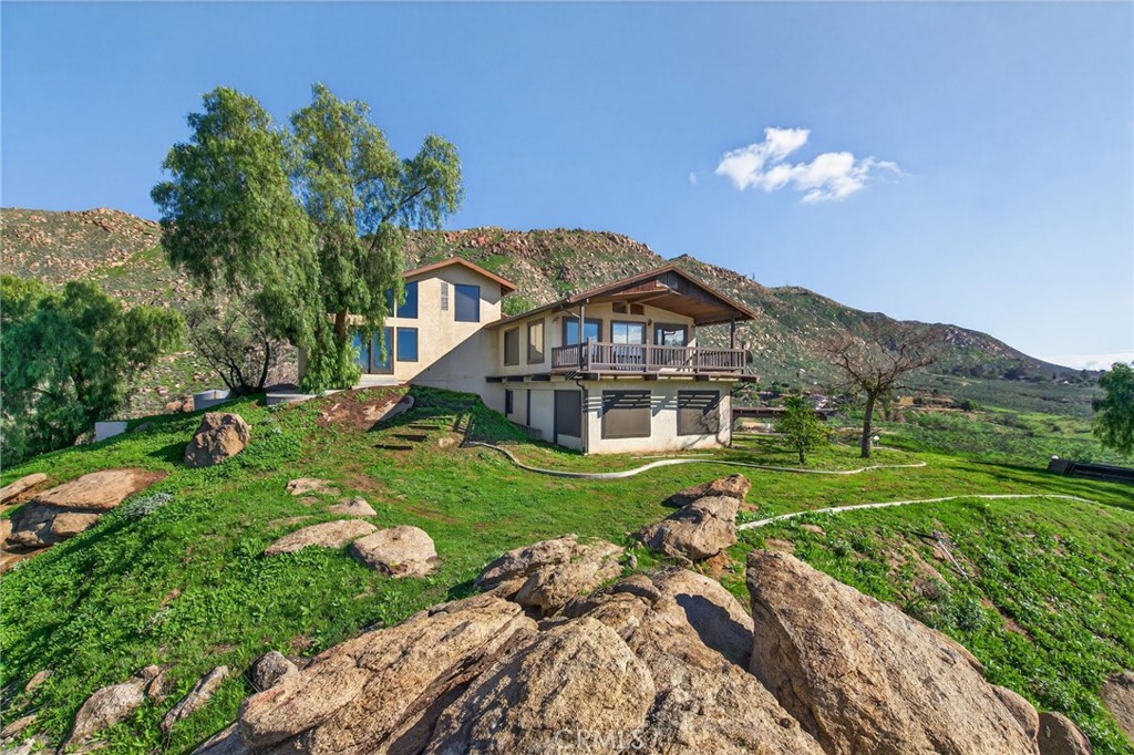 20682 Hill Top Drive Riverside, CA 92507 - Photo 5 of 70 a view of a house with a yard