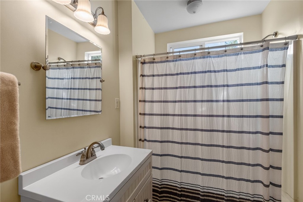 20682 Hill Top Drive Riverside, CA 92507 - Photo 55 of 70 a bathroom with a sink and a shower