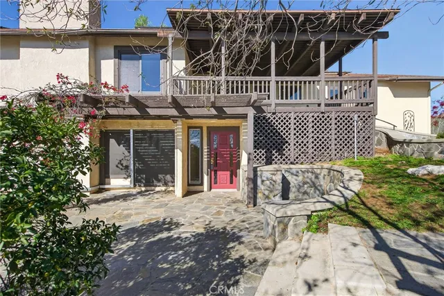 a view of a balcony with couch and wooden floor