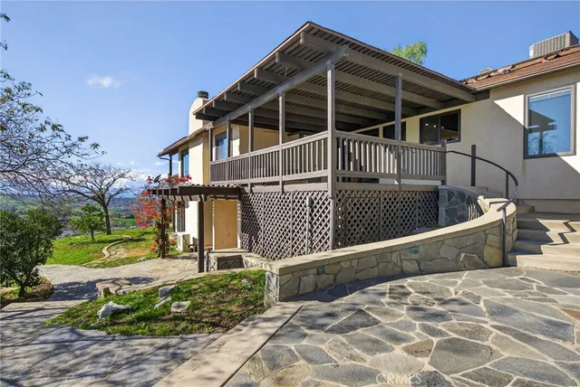a view of a balcony with wooden floor