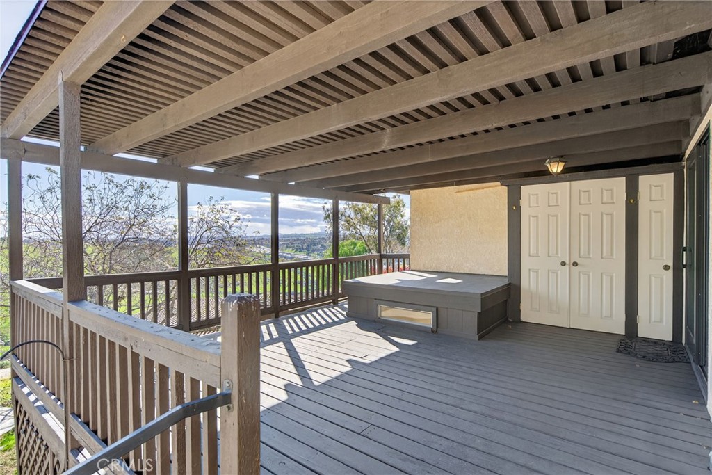 20682 Hill Top Drive Riverside, CA 92507 - Photo 9 of 70 a view of a balcony with couch and wooden floor