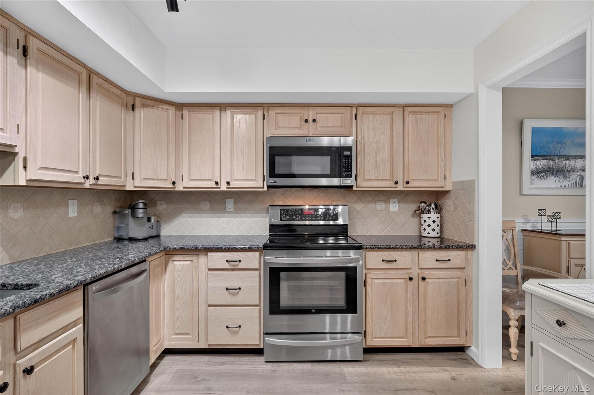 2 Deer Crossing Drive Fishkill, NY 12524 - Photo 21 of 49 a kitchen with stainless steel appliances granite countertop a stove a sink and a microwave