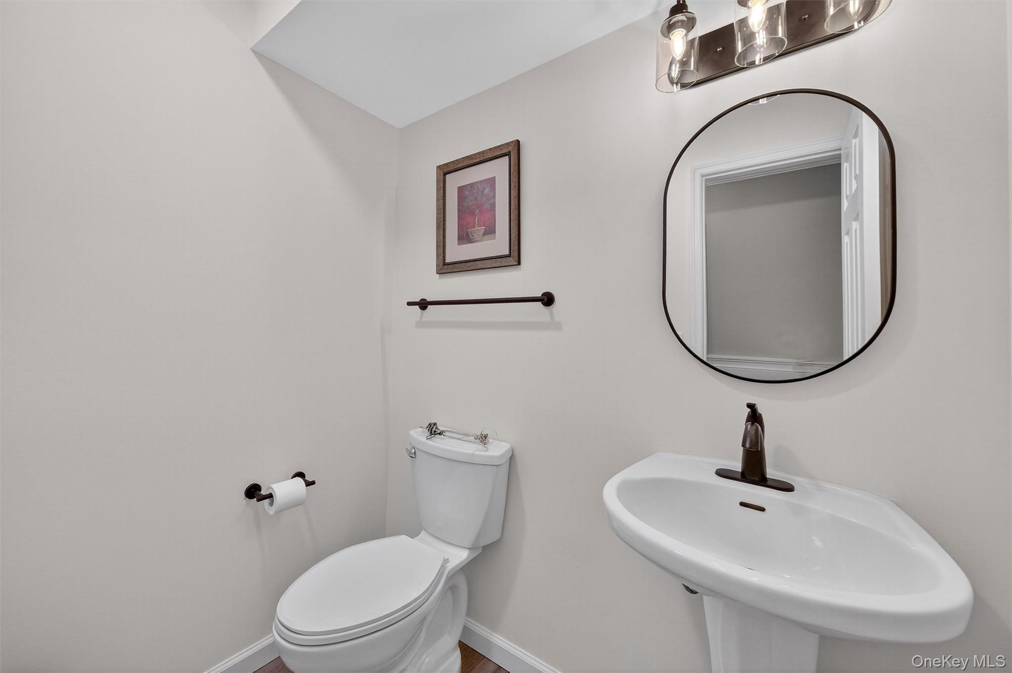 2 Deer Crossing Drive Fishkill, NY 12524 - Photo 23 of 49 a bathroom with a toilet sink and mirror