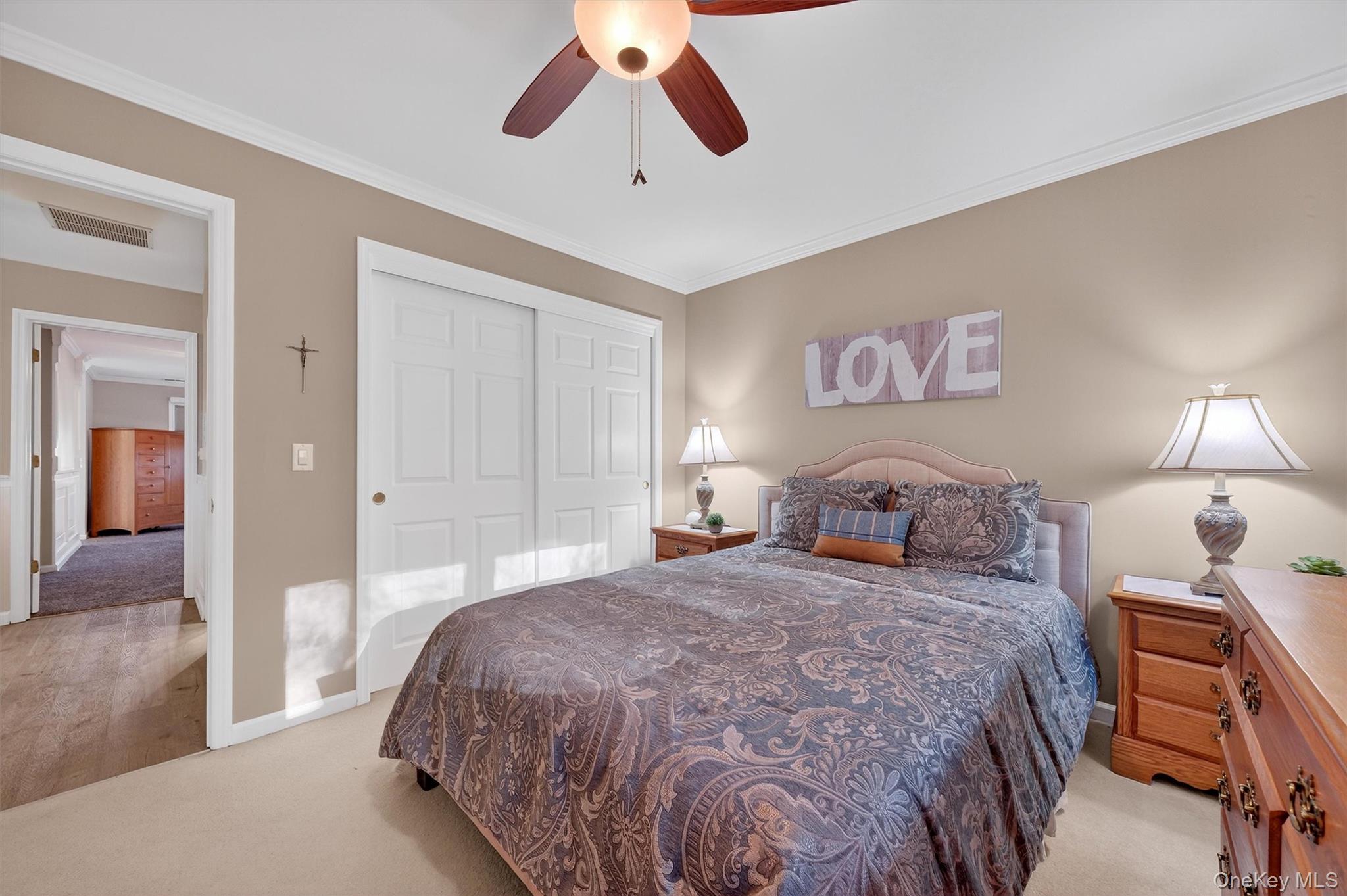 2 Deer Crossing Drive Fishkill, NY 12524 - Photo 28 of 49 a bedroom with a bed and a chandelier