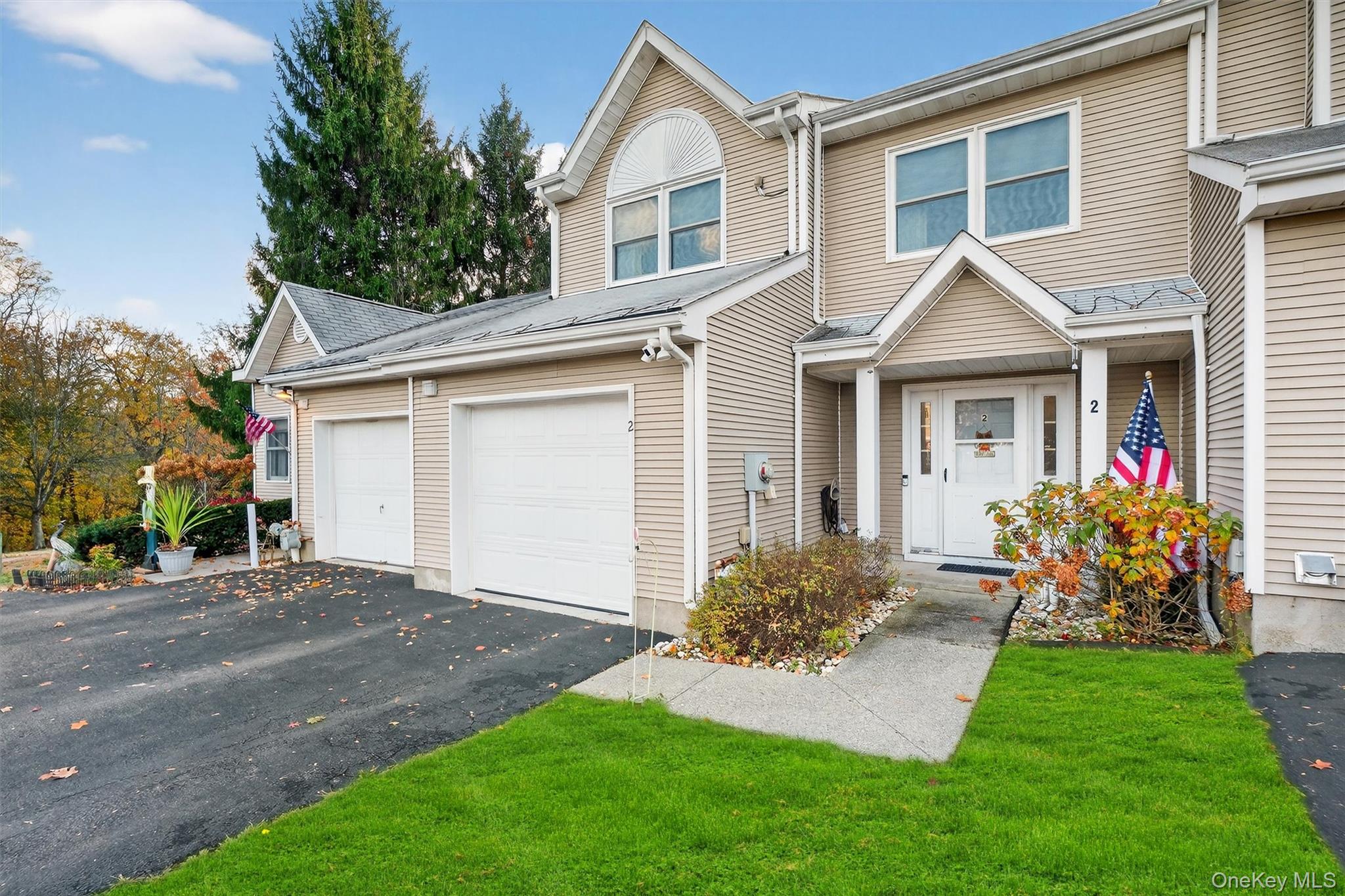 2 Deer Crossing Drive Fishkill, NY 12524 - Photo 3 of 49 a front view of a house with a yard and garage