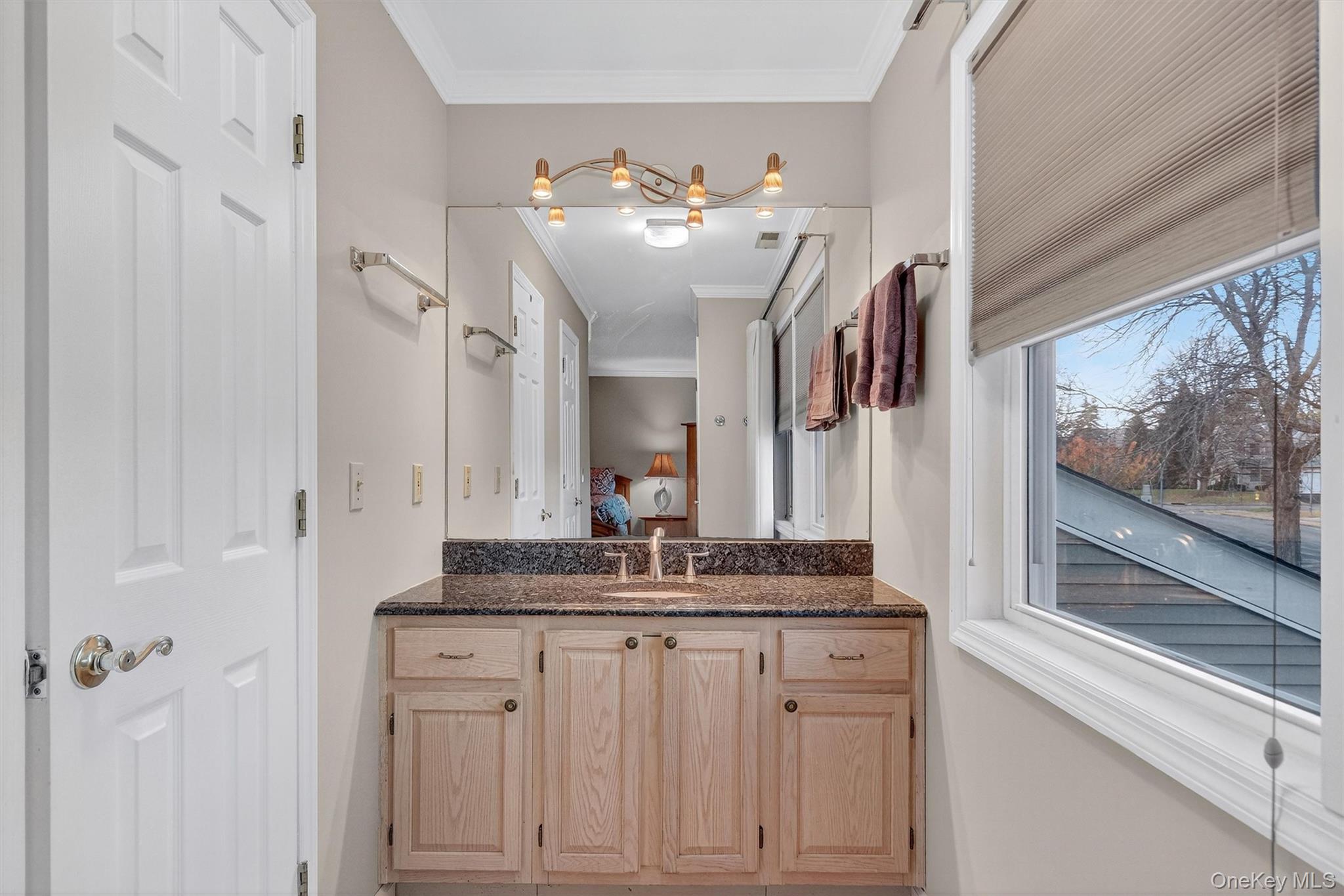 2 Deer Crossing Drive Fishkill, NY 12524 - Photo 35 of 49 a bathroom with a granite countertop sink a large mirror and a window