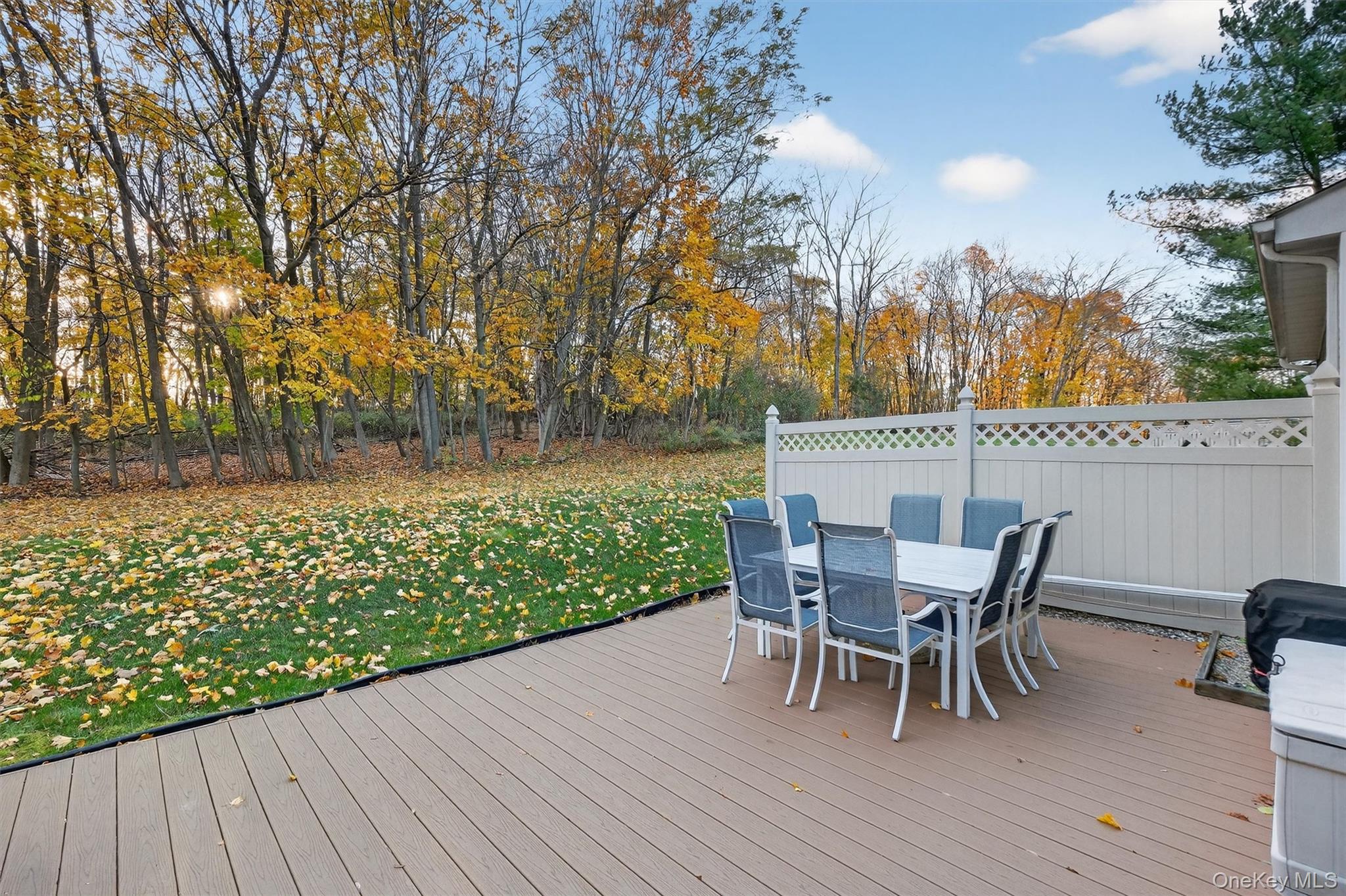 2 Deer Crossing Drive Fishkill, NY 12524 - Photo 41 of 49 a view of a patio with table and chairs with wooden floor and fence