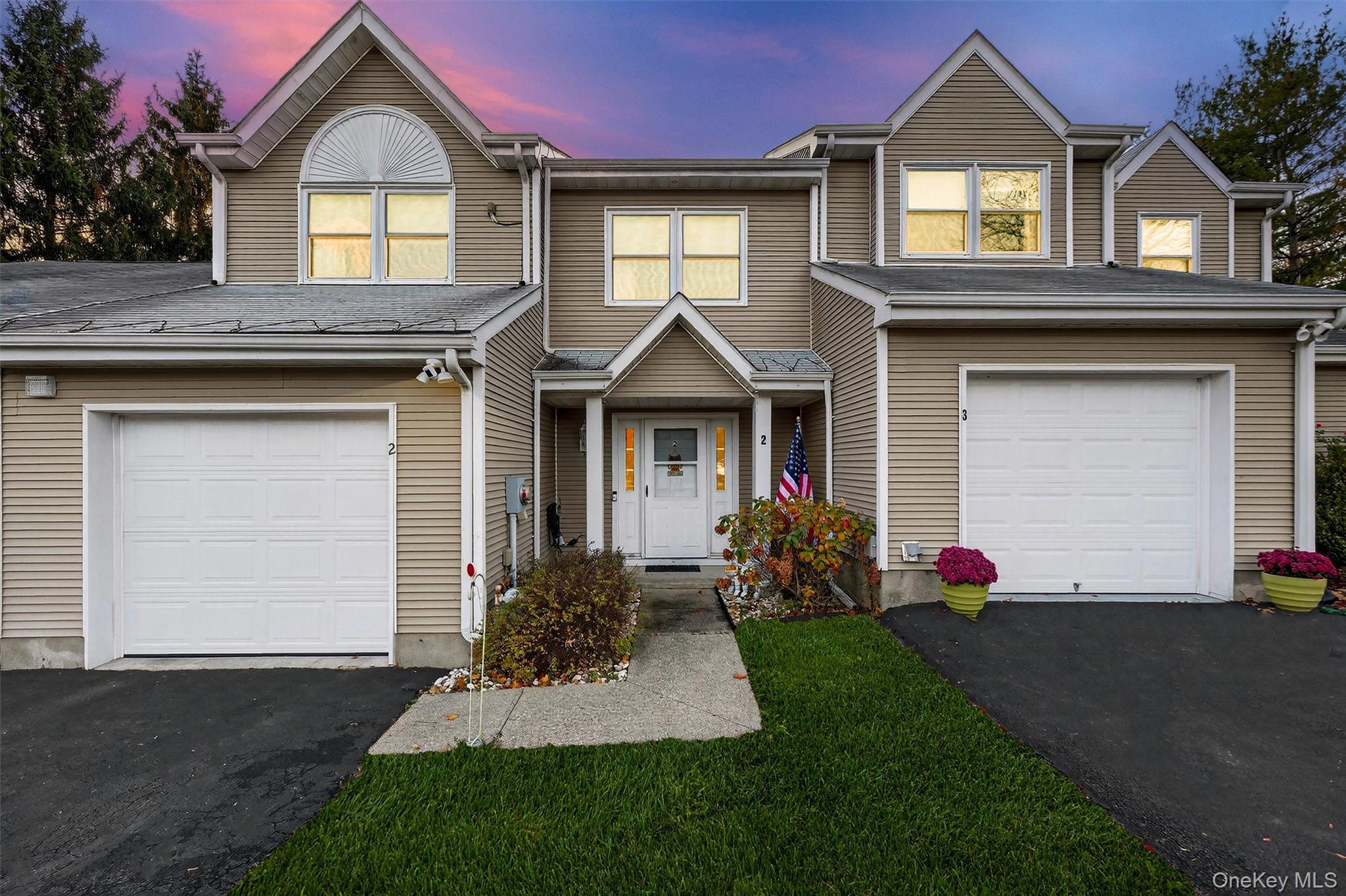 2 Deer Crossing Drive Fishkill, NY 12524 - Photo 48 of 49 a front view of a house with a yard and garage