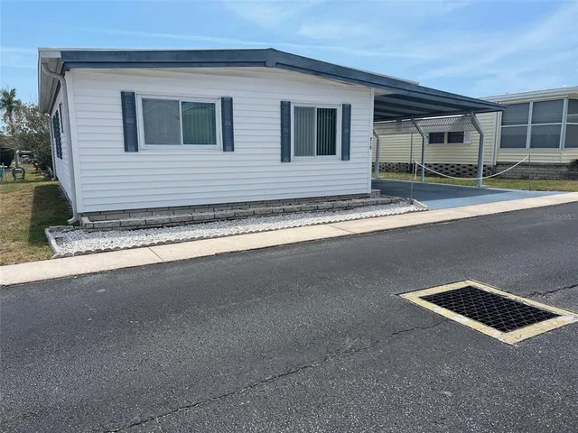 a view of a house with a street