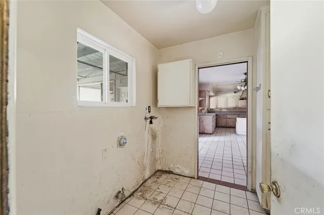 a bathroom with a granite countertop sink a mirror and shower