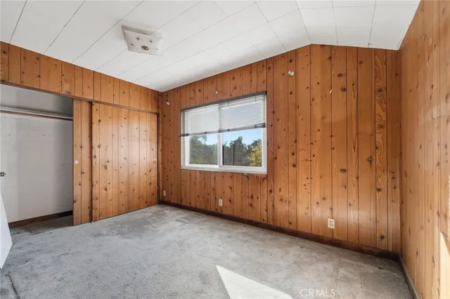 a view of empty room with cabinet