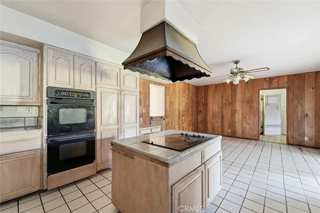 a kitchen with a stove and a refrigerator