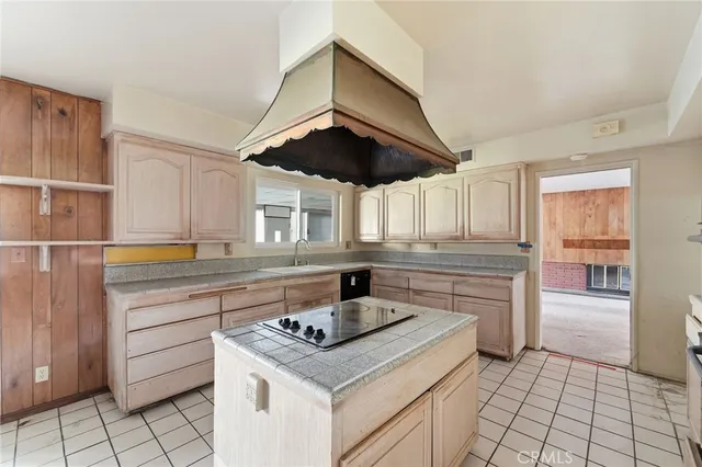 a kitchen with a stove and a sink