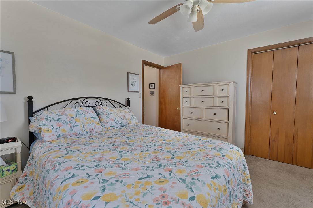 9925 Struthers Road New Middletown, OH 44442 - Photo 11 of 12 Carpeted bedroom featuring a closet and ceiling fan