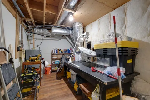 a utility room with lots of wooden furniture