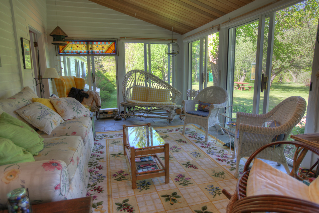 34 Sandisfield Road Sandisfield, MA 01255 - Photo 14 of 25 a living room with furniture a flat screen tv and a floor to ceiling window