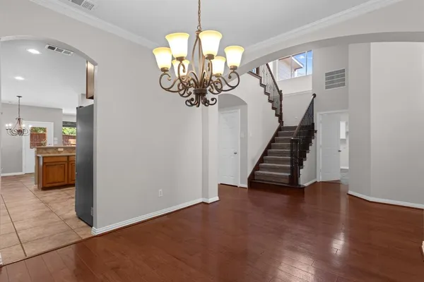 a view of an entryway with wooden floor