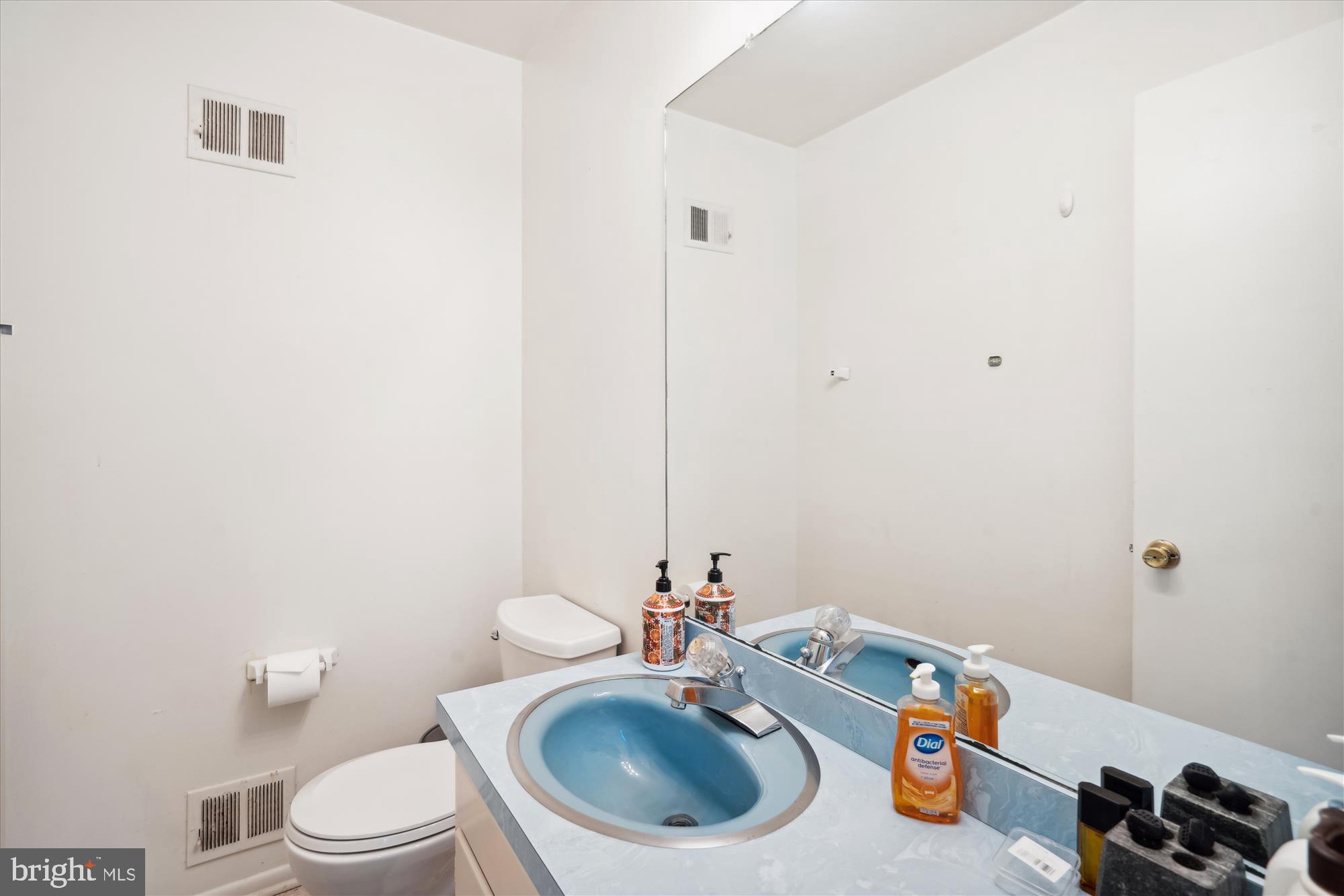 4701 Norwich Road College Park, MD 20740 - Photo 7 of 16 a bathroom with a sink a toilet and a mirror
