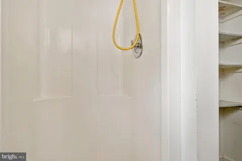 a bathroom with a glass shower door