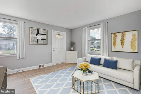a living room with furniture and window