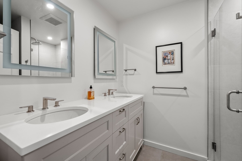 32 Lime Street Boston, MA 02108 - Photo 16 of 30 a bathroom with a sink and a mirror