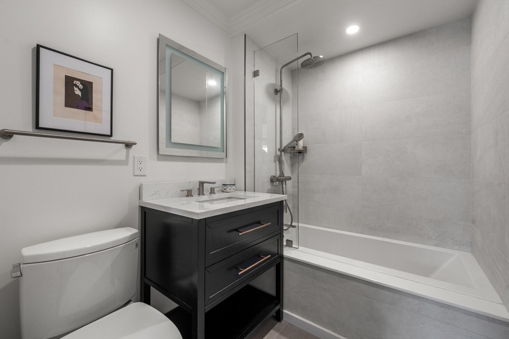 32 Lime Street Boston, MA 02108 - Photo 22 of 30 a bathroom with a sink a toilet and shower