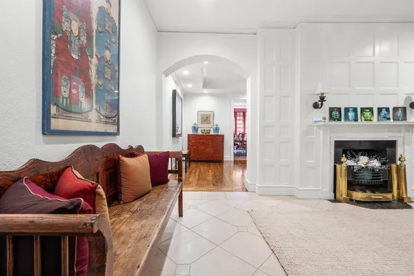 a living room with furniture and a fireplace