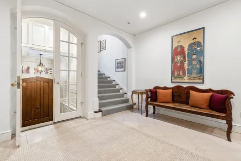 a bedroom with furniture and a window