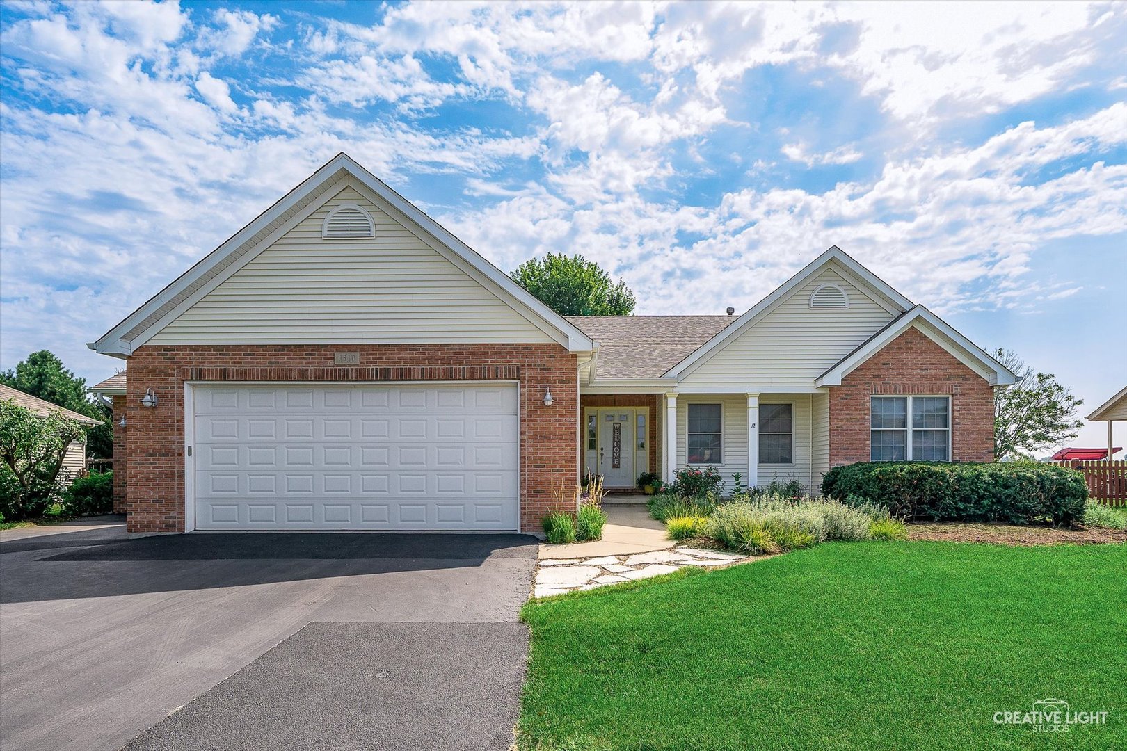 1310 Arneita Street Sycamore, IL 60178 - Photo 2 of 2 a front view of house with yard and green space