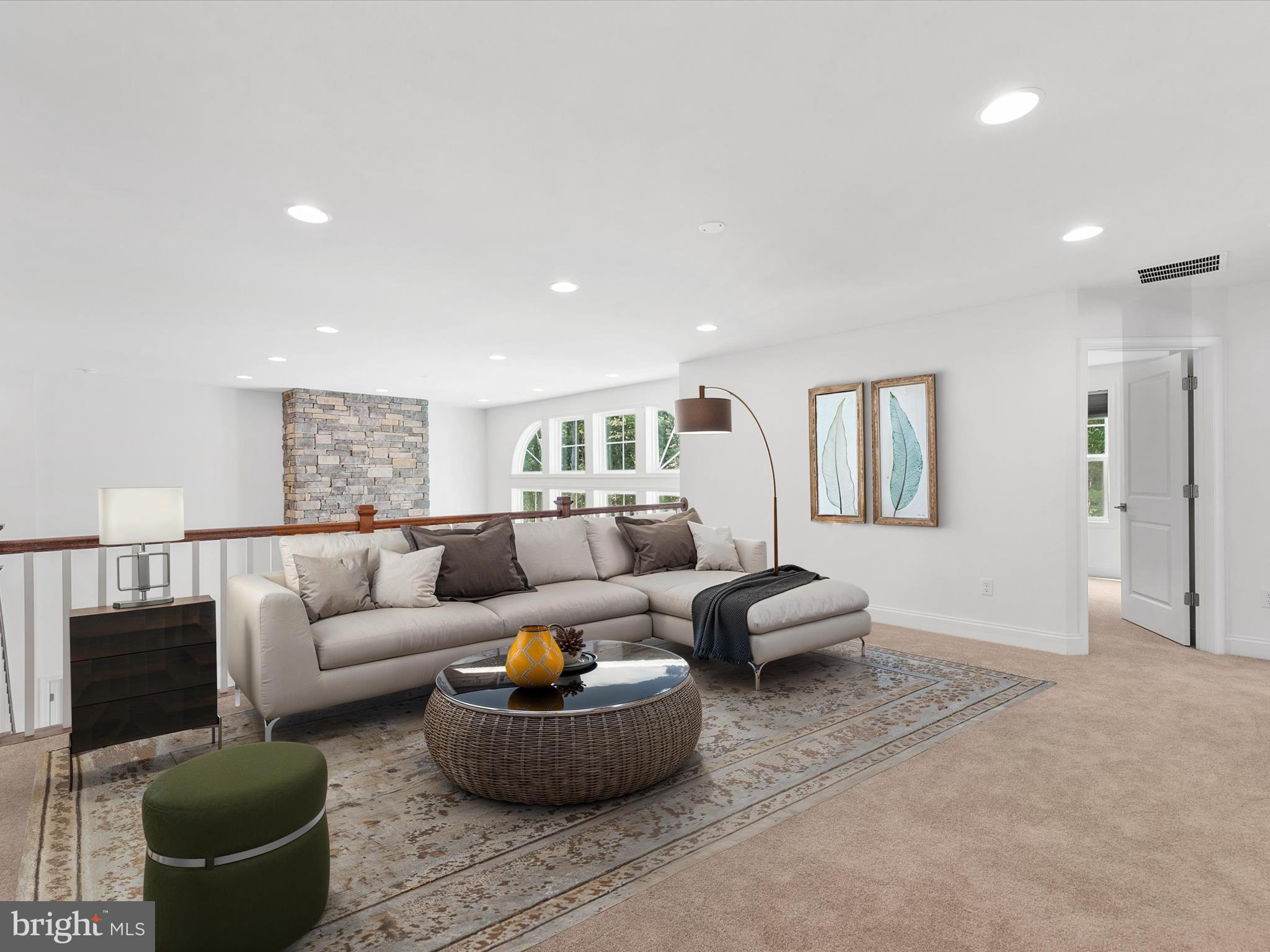 21650 Eastbridge Loop Lewes, DE 19958 - Photo 11 of 106 a living room with furniture and a potted plant